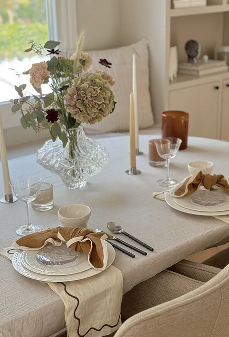 orange table setting from side two plates